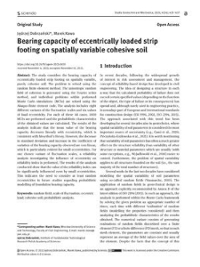 Bearing capacity of eccentrically loaded strip footing on spatially variable cohesive soil