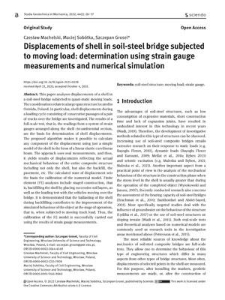 Displacements of shell in soil-steel bridge subjected to moving load: determination using strain gauge measurements and numerical simulation